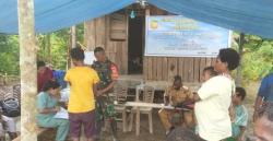 Babinsa Koramil 1710-06/Agimuga Dampingi Petugas Kesehatan Dalam Kegiatan Posyandu